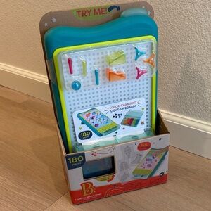 B. Color-Changing Light-Up Peg Board Toy